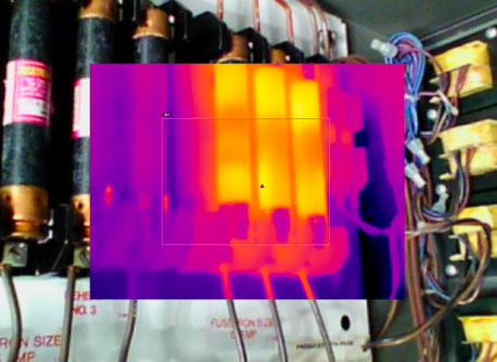 Thermal image inset over a visible-light view of electrical components.