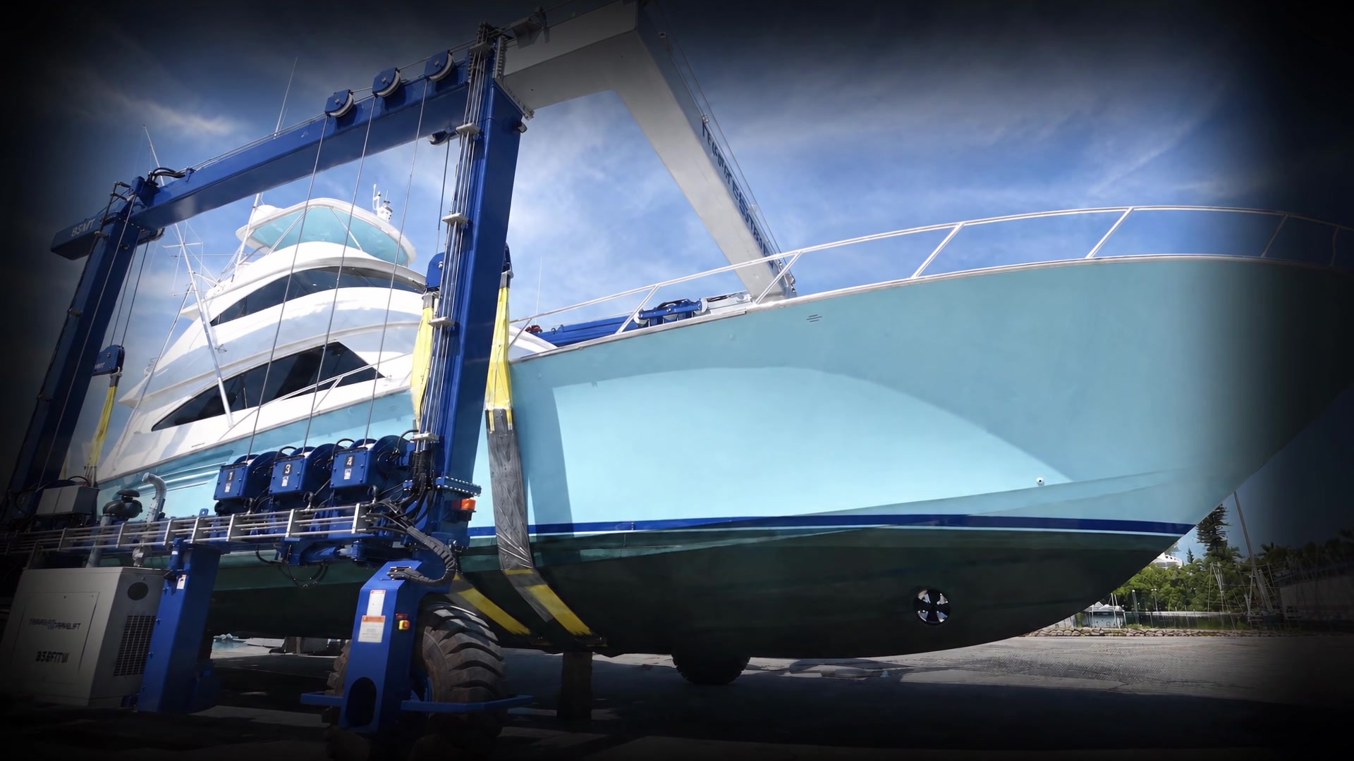 Yacht in a travel lift during haul-out